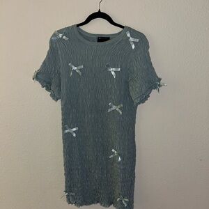 Textured Light Blue Dress with Bow Accents
